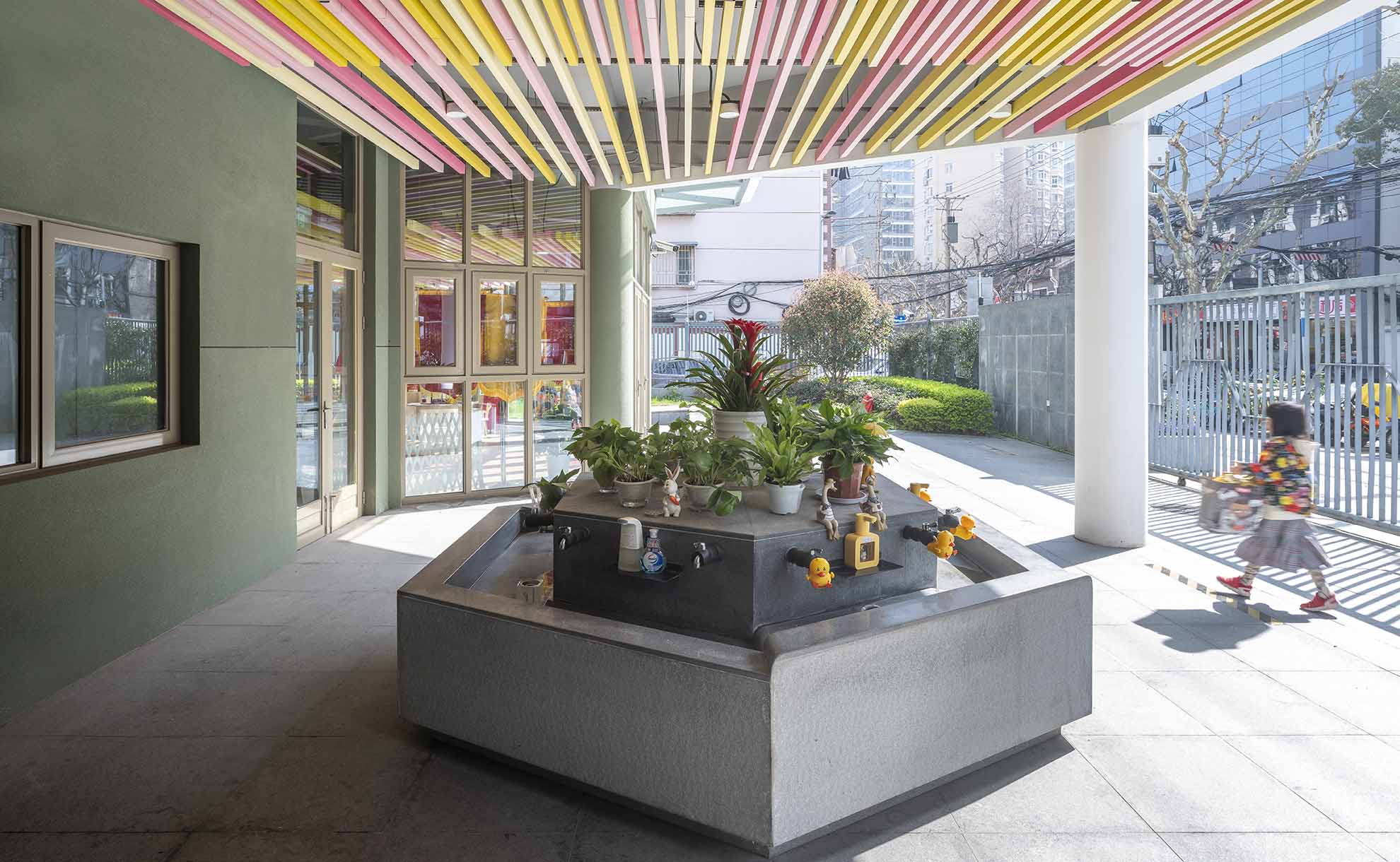 Entrance area of a kindergarten in Shanghai with colourful design and interactive elements.