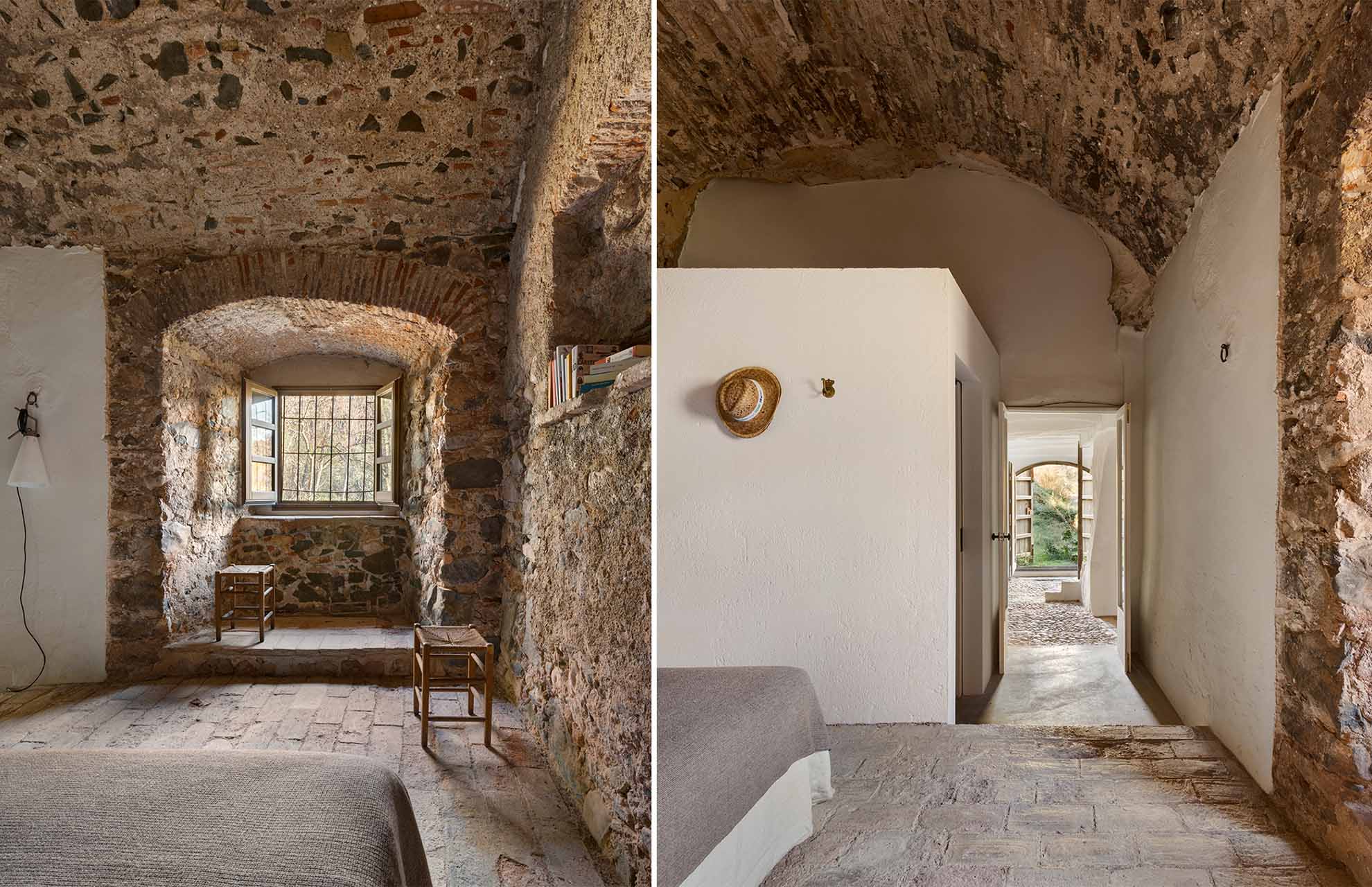 Sala circular con techos abovedados de ladrillo visto y detalles en hierro forjado, rehabilitada con materiales tradicionales en un entorno natural.